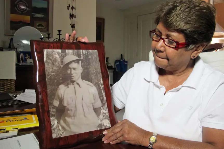 Linda Boney proudly holds a photo of her father (courtesy ABC News)